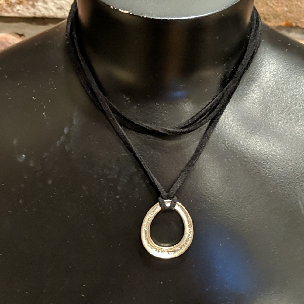 Open tear drop pendant with black necklace